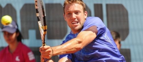 Jack Sock plays a backhand shot. Photo by Tatiana -- CC BY-SA 2.0)