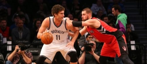 Brook Lopez, starting center for the Brooklyn Nets, backing down Jonas Valanciunas of the Toronto Raptors - nothinbutnets.com
