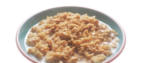 A single bowl of cooked hot cereal, oatmeal with milk./ via National Cancer Institute wikimedia