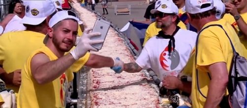 Photo screen capture from YouTube video / RT News