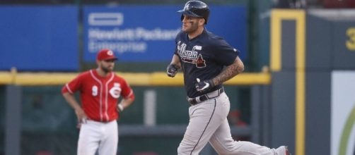 Matt Adams' grand slam, homer in 12th send Braves past Reds ... - timesfreepress.com