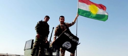 Peshmerga throw away the ISIS flag and hang up the Kurdish&hellip; | Flickr - flickr.com
