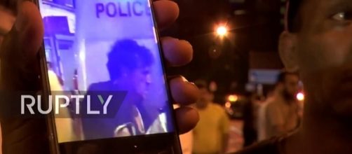 Photo van driver as he is arrested screen capture from YouTube video / RT News