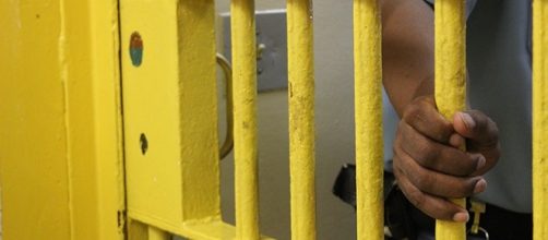 Officer closing entrance to cell block inside Georgia Diagnostic & Classification Prison. Photo via Georgia Department of Corrections.