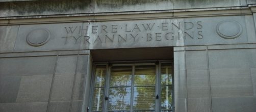 Motto over window of U.S. Department of Justice. / [Image by Joe Campbell via Flickr, CC BY-SA 2.0]