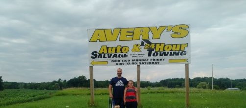 Supporters in front Of Avery Auto Salvage sign/photo credit Dana L Weinert/Facebook