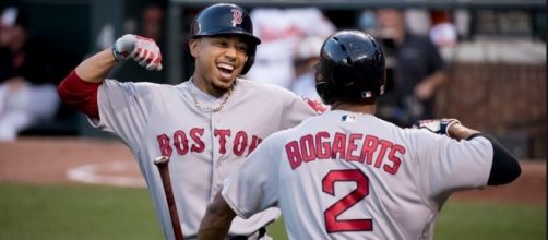 Betts celebrating with Bogaerts, Flickr, Keith Allison CC BY-SA 2.0 https://www.flickr.com/photos/keithallison/27337799641