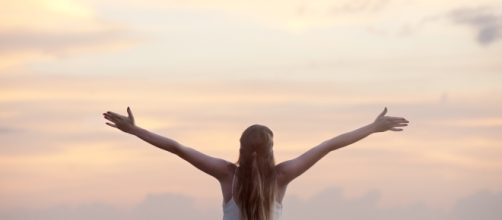 Woman relaxed on a beach via www.pexels.com