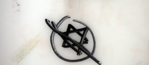 AntiSemitic marking on University of Chicago bathroom wall / [Image by Quinn Dombrowski via Flickr, CC BY-SA 2.0]