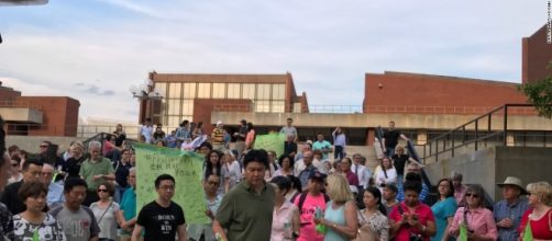 Univ. of Illinois kidnapper was at rally for victim. Note man in black on upper right. / from 'CNN' - cnn.com