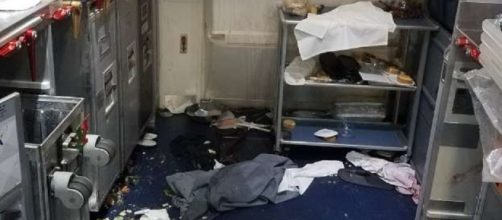 Delta flight attendant breaks wine bottle over unruly passenger's head. Photo: Offiice of the U.S. Attorney General