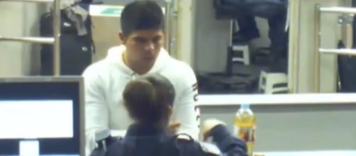 A still showing Cruz Velazquez Acevedo talking with one of the officers who asked him to drink from the bottle. - YouTube/IRATE Productions
