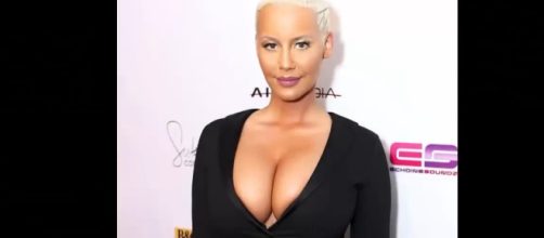 Amber Rose considers getting a breast reduction procedure. Image via YouTube/Hot News