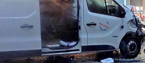 Catalonia police are still seeking the driver of the van, pictured above, in the Barcelona attack [Image: YouTube/The Telegraph]