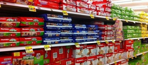 Diapers on display in a supermarket / Photo via ParentingPatch , Wikimedia Commons