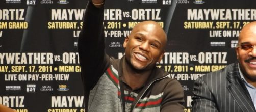 A proud boxing champion ploughing through the field he calls Career - Bryan Horowitz via flickr.com