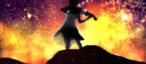 Playing with fire. Image via Pixabay.