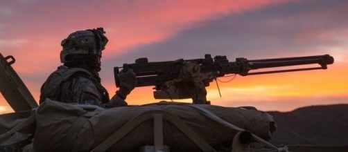 A soldier breaches an enemy compound. / [Image by DVIDSHUB via Flickr, CC BY 2.0]