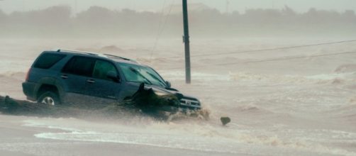 A car is surrounded by floodwaters from Hurricane Harvey in Point Comfort, Texas, August 26, 2017.