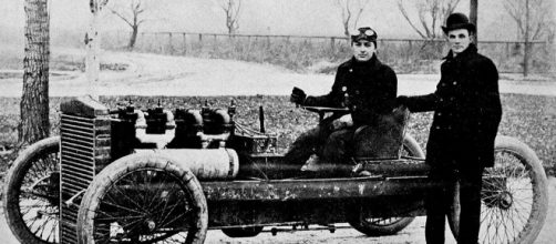 Henry Ford is the father of the mass market automotive industry as we know it today - Henry Ford & Barney Oldfield in 1902 via Wikimedia Commons