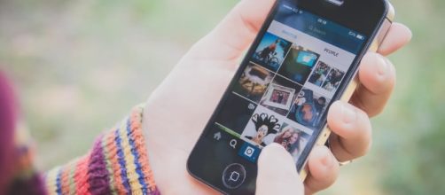 User using social media -- image via Flickr.