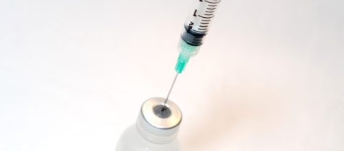 "Syringe and Vaccine" by NIH from NIAD on Flickr. Used under CC BY 2.0