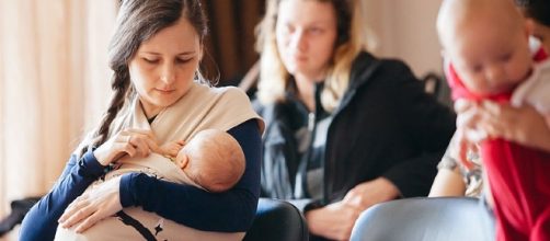 Mother feeding her baby. [Image via UNICEF/Wikimedia Commons]