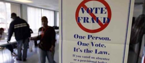 Sign warning against voter fraud. (YouTube snipped)