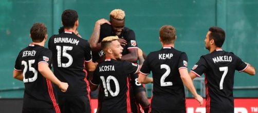 DC United player celebrate a goal against New England wikimedia.org