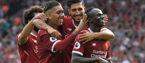 Liverpool players celebrate a goal wikimedia.org