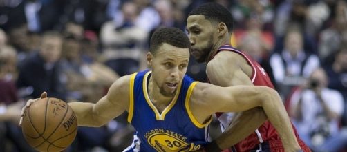 Golden State Warriors guard Stephen Curry dribbles the ball. Image Credit: Keith Allison, Flickr -- CC BY-SA 2.0