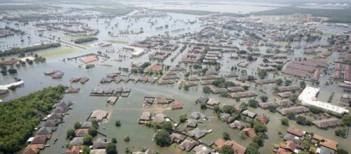 Hurricanes carring heavy rains and high winds devastation of lives and property. [Image via South Carolina National Guard/Wikimedia Commons]