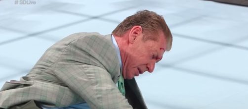 Vince McMahon was left bloody and bruised after Kevin Owens attacked him on 'SmackDown Live.' [Image via WWE/YouTube]