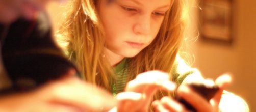 Elementary-aged children more likely to experience cyberbullying if they their own phone. - Image Credit: Tinkerbrad/ Flickr