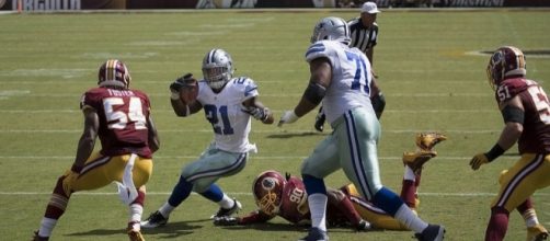 Dallas Cowboys running back Ezekiel Elliott rushing against the Washington Redskins. Image Credit: Keith Allisson, Flickr -- CC BY-SA 2.0