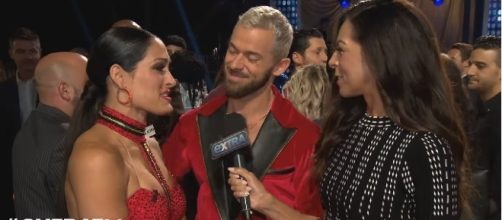 Nikki Bella with partner Artem Chigvintsev after their performance in "Dancing With the Stars." Photo - extratv/YouTube