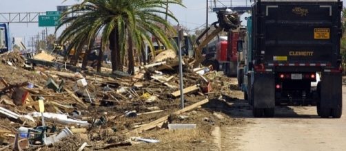 Clearing the debris after a hurricane (Credit - Brooks O. Hubbard IV &ndash; Wikimedia Commons)