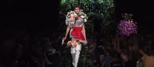 Floral designs on the runway. [Image Credit: Moschino Official/YouTube]