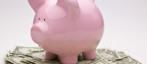 Piggy bank and paper bills | photo via Ken Teegardin, Flickr