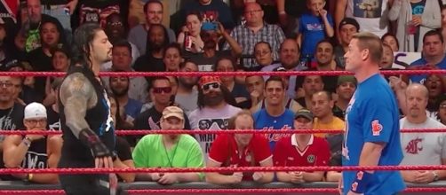 Roman Reigns and John Cena are tied atop the odds list for who might win the 'Royal Rumble' match next year. [Image via WWE/YouTube]