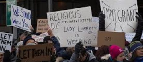 Protest against Trump's travel ban/WikimediaCommons/https://commons.wikimedia.org/wiki/File:2017-01-28_-_protest_at_JFK_(80929).jpg
