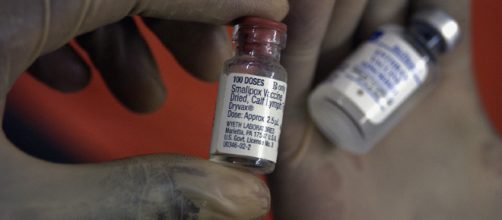 A researcher holding a vial of the smallpox vaccine in Baghdad, Iraq. - [Master Sgt. Keith Reed / Wikimedia Commons]