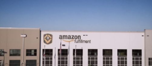 Starting Nov. 1, Amazon will raise its minimum wage to $15 for all employees. [Image source: CNBC - YouTube