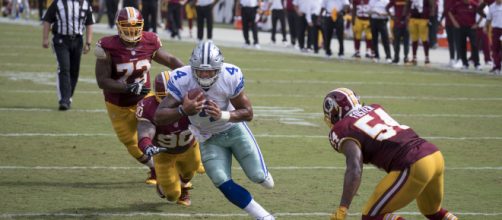 Quarterback Dak Prescott of the Dallas Cowboys hopes to run past the Washington Redskins on Thanksgiving Day. [Image via Flickr -- Keith Allison]