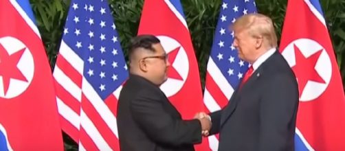 Moment Kim Jong-un and Donald Trump share historic handshake [Image courtesy &ndash; Guardian News YouTube video]