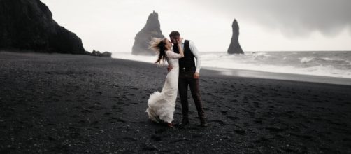 Couple enjoy a winter wedding. Image Credit: Dmitry Schemelev on Unsplash