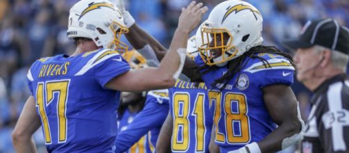 The Chargers try to take over first place tonight against the Chiefs. [Image via USA Today/YouTube]