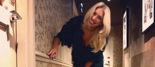 Stassi Schroeder poses in a hallway. [Photo via Facebook]