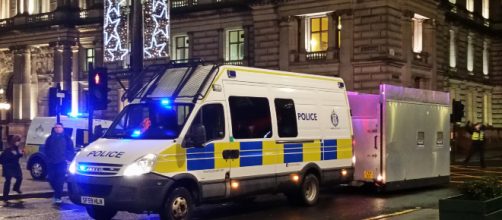 British police van guards the street. - [Image via Michel Curl - Flickr]