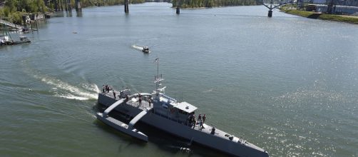 The US Navy's first unmanned ship launches from Oregon. By U.S. Navy -- photo by John F. Williams/Released [Public domain], via Wikimedia Commons